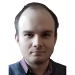 Ukrainian Alliance Чоловік із лисою головою та синім светром представляє Український Альянс.